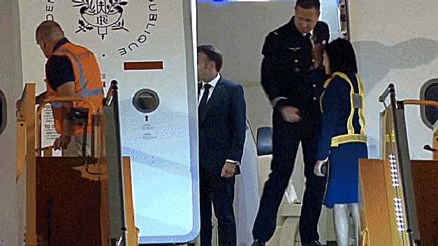 French First Lady Pushes Husband Emmanuel Macron in Viral Airport Video