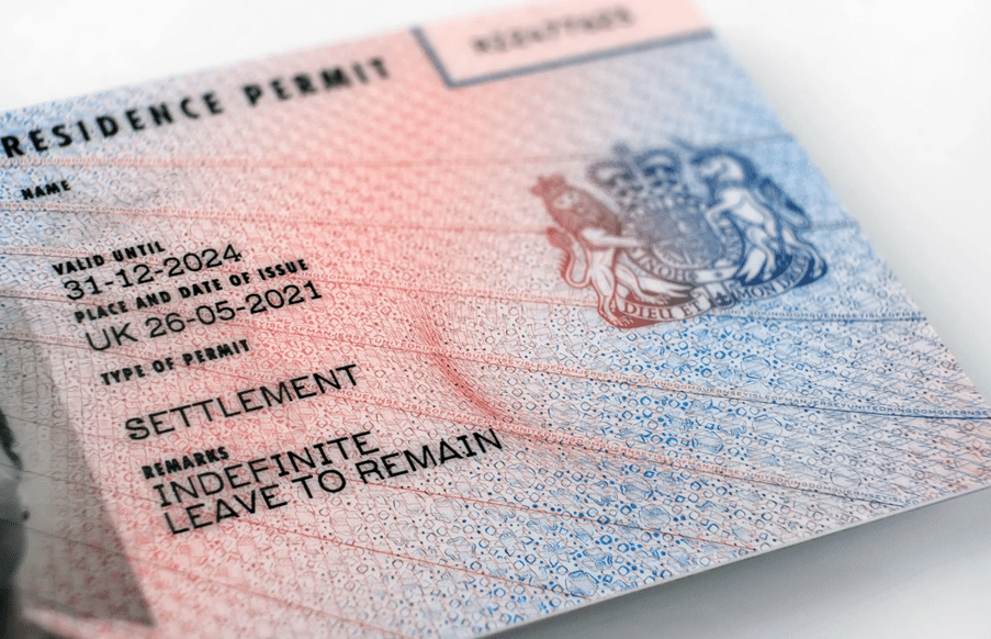 Featured image for ILR application as refugee UK showing a BRP card with the UK flag.