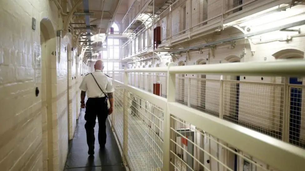 At least four prisoners freed in error still at large